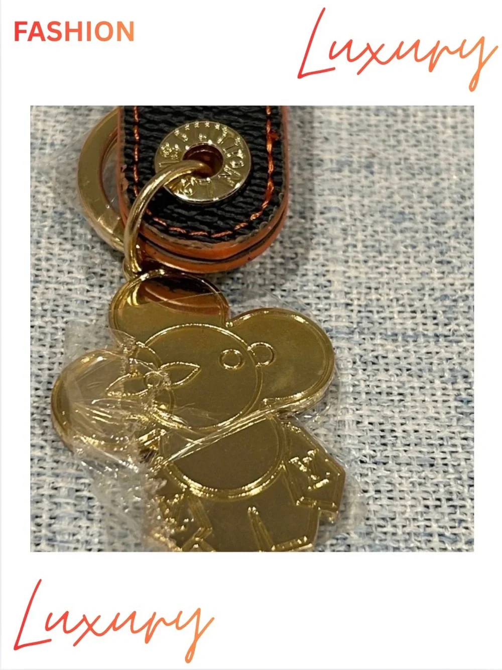 KEYCHAIN BAG CHARM WRISTLET: Gold & Orange Floral Figure w/Brown Leather Strap